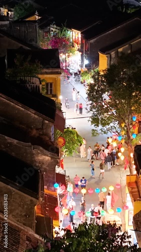 Panorama aerial drone view of Hoi An ancient town with boat tour and beautiful lanterns in night. UNESCO world heritage. One of the most travel popular touristic destinations 