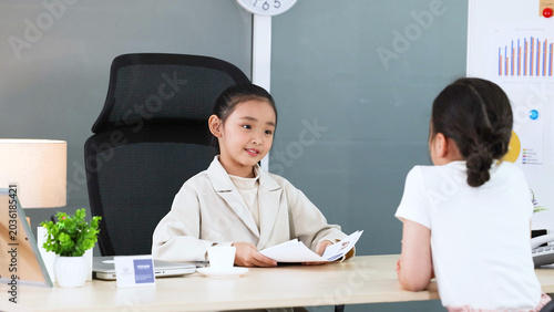 Φωτογραφία Young Asian Girl in White Blazer Roleplaying as Business Executive