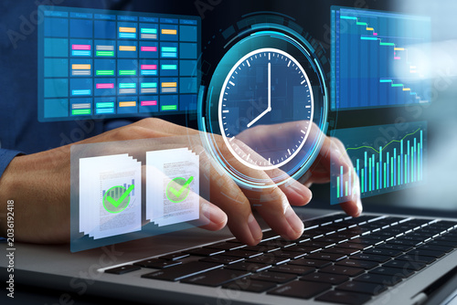 Time management and task scheduling. Prioritization for productivity. Businessman setting goals and tracking time on a laptop computer.