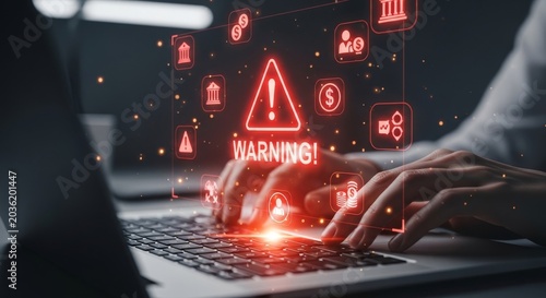Cybersecurity warning alert on laptop with glowing red digital icons and hands typing