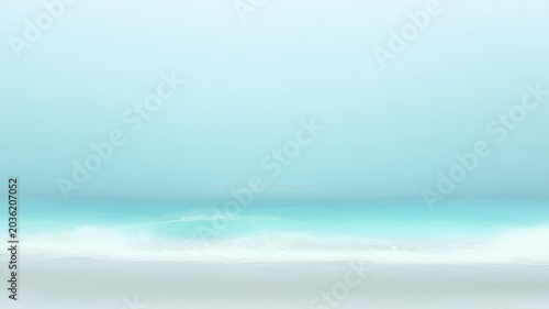 Minimalist turquoise ocean shoreline with soft misty atmosphere and blurred waves for calm backgrounds and peaceful wall decor art.