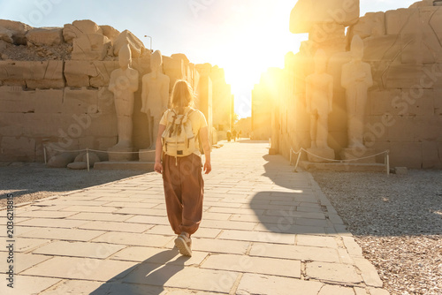 Valokuva Walking towards the sun at a historical site in Luxor, Egypt during sunset with