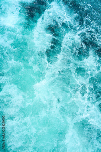 Blue sea water with spray