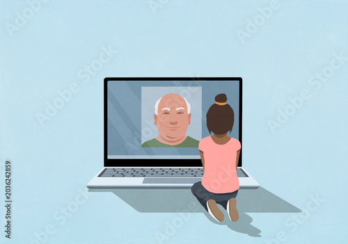 Young girl video chatting with old man on laptop screen