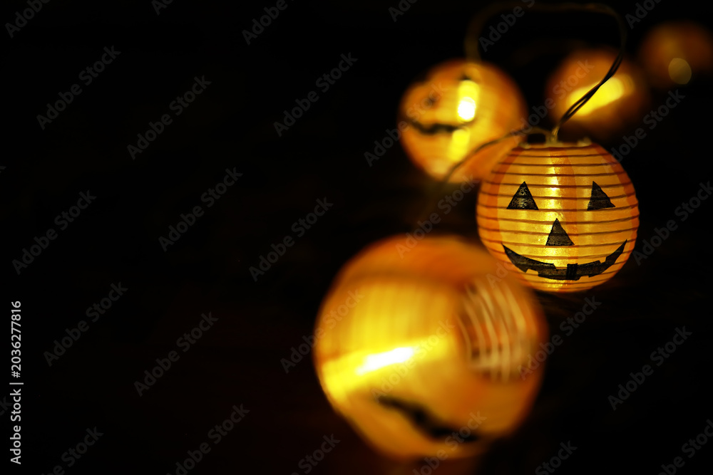Obraz premium Close-Up of Illuminated Jack-O'-Lantern Lights for Halloween Decoration