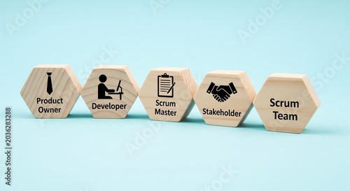 Wooden hexagonal blocks illustrating key roles and concepts within the Agile Scrum framework, including Product Owner, Developer, Scrum Master, Stakeholder, and Scrum Team, on a blue background.
