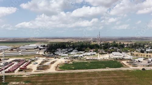Aerial View Of Nir Oz Near Gaza Border Israel
Drone footage overlooking Nir Oz kibbutz and Shujaiyya Gaza skyline May 26 2026 Israel
