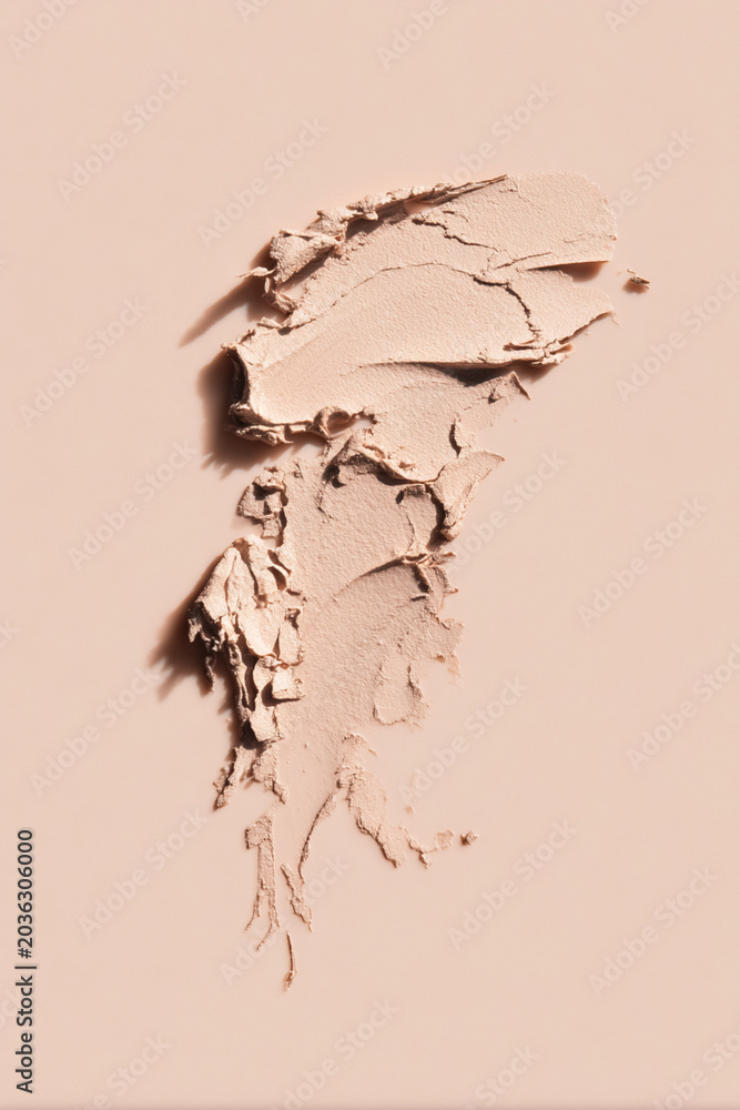 Fototapeta premium Beige cosmetic foundation swatch showing creamy texture and skin tone color for beauty and make up concepts