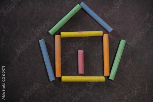 Multicolored dustless chalk sticks creating vibrant artistic designs for educational and creative classroom activities.