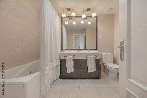 Photos This bathroom embraces the duality of materials: the robustness of the polished concrete vanity is balanced by the subtlety of a sink sculpted from a single piece of white resin