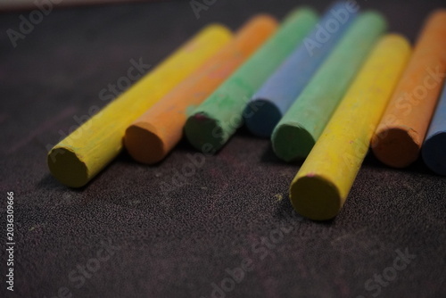 Multicolored dustless chalk sticks creating vibrant artistic designs for educational and creative classroom activities.
