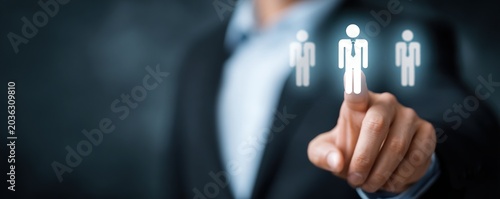 Businessman selecting profile from digital personnel interface