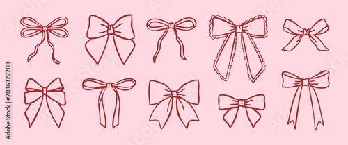 Photos Set of elegant hand drawn bows and ribbons in doodle outline style on a pastel pink background