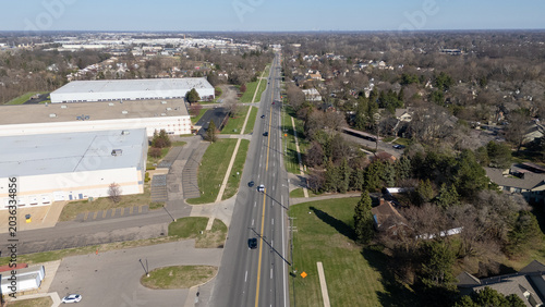 Aerial view of a highway passing through industrial zone