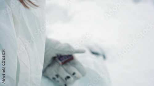 Struggling through freezing loneliness alone. Enduring frigid isolation during harsh winter survival ordeal. Facing extreme cold and profound solitude in demanding winter survival scenario