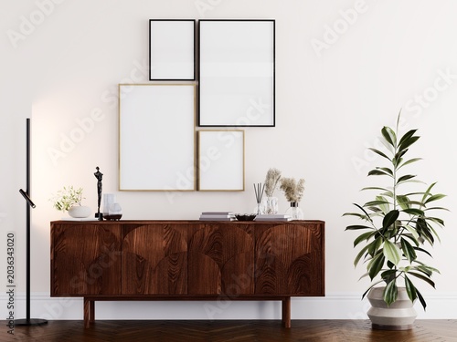 Luxury classic living room interior with blank gallery wall frames mockup, elegant molding details and stylish modern decor.