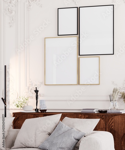 Luxury classic living room interior with blank gallery wall frames mockup, elegant molding details and stylish modern decor.