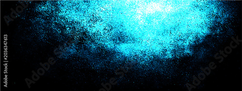 Obraz na płótnie Abstract glowing blue particle explosion on black background representing energy, power, and dynamism