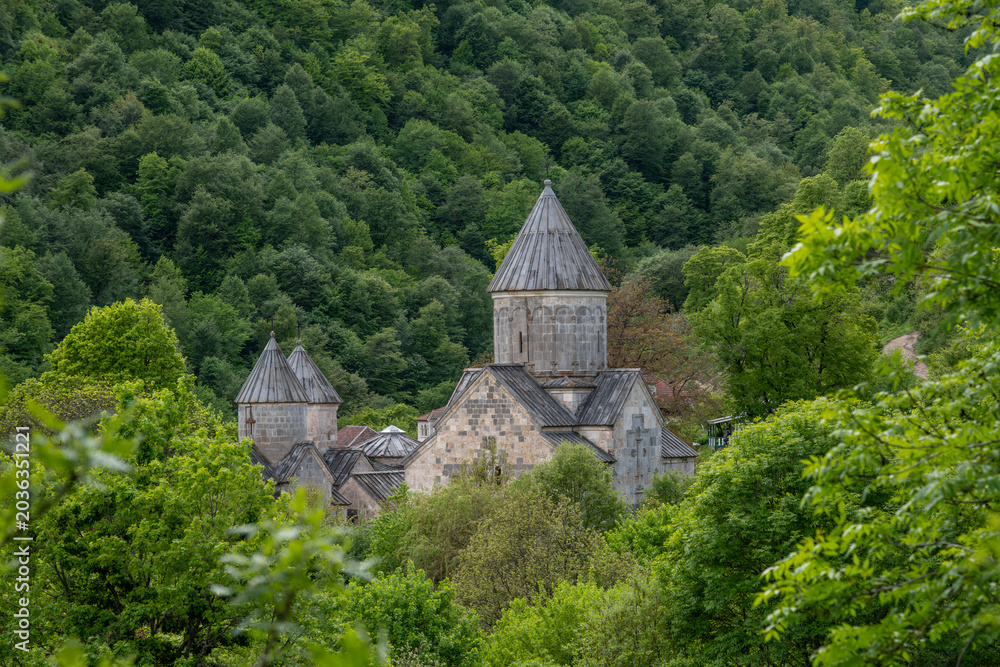 Obraz premium Haghartsin Monastery surrounded by lush forest in Dilijan National Park Armenia.