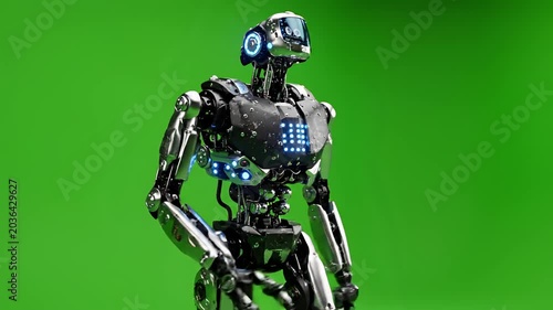 Futuristic humanoid robot with glowing blue lights on green screen background.