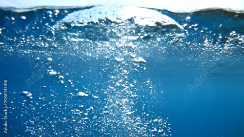 Underwater Bubbles Rising Through Clear Blue Water.