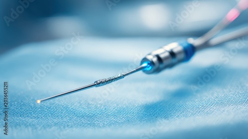 Flow reserve FFR pressure wire placed neatly on cloth surface in medical setting