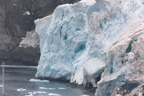 South Orkney blue iceberg on a cloudy winter day.