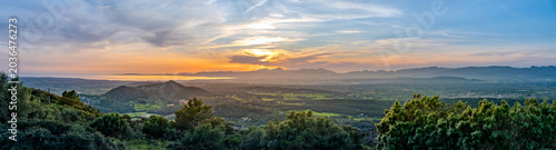 Wide panorama sunset view on Balearic Island Mallorca, with bay of Palma and mountain range Serra de Tramuntana in the distance
