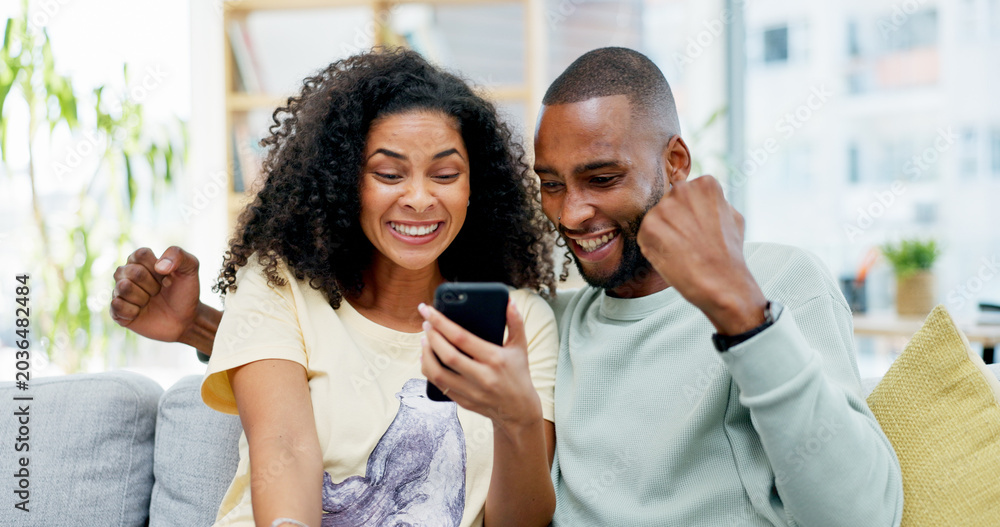 Fototapeta premium Couple, phone and sofa with celebration, success or good news for loan, bonus or online sale at home. Winner, excited and people with mobile app for registration, sign up or approval of subscription
