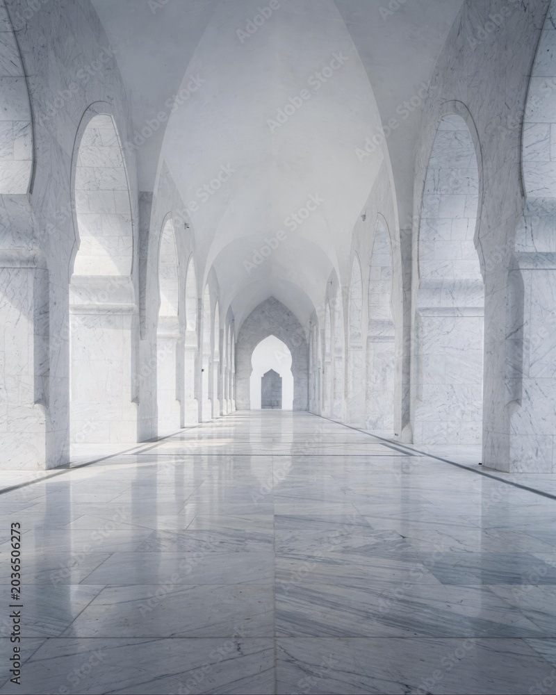 Obraz premium Symmetric white marble corridor with pointed arches to vanishing point