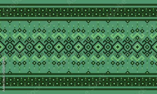 Traditional tribal geometric seamless pattern in green tones with pixel-style ethnic motifs for textile, fabric, wallpaper, and background design.
