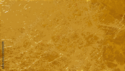 Fotografie Gold foil texture with scattered white flecks presents a granular metallic surfa
