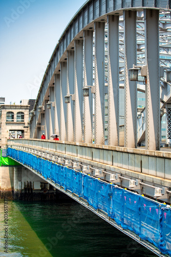 Фотография View of the bridge leading to Tsukiji Fish Market in Tokyo, showcasing bustling