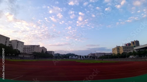 School Athletic Track on Campus at Sunset