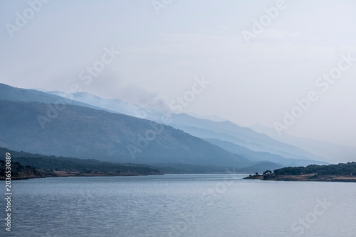 Smoke from a forest fire in a mountain