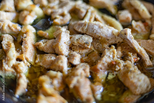 Close-up of juicy braised pork chunks in savory sauce