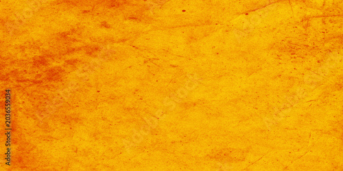 Bild auf Leinwand Vibrant orange textured background with subtle scratches and imperfections