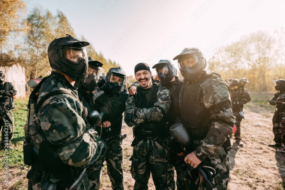 Fototapeta premium Paintball Players Ready for Outdoor Challenge