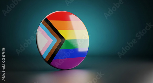 A glossy circular pin featuring the progressive pride flag design, symbolizing diversity, inclusivity, and LGBTQ+ rights. It is displayed on a reflective surface against a teal gradient background