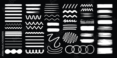 Collection of white hand drawn brush strokes, lines, and shapes on black background