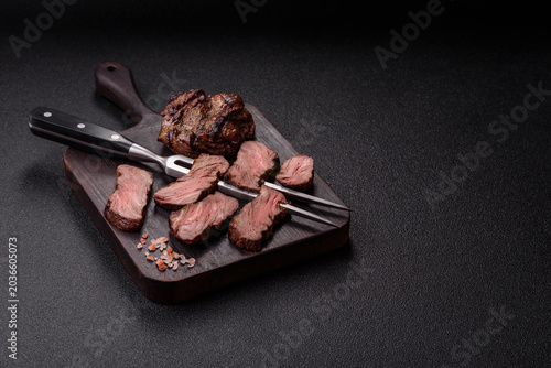 Beef mignon steak, rare, meat grilled with salt and spices. Beef steak