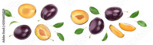 fresh purple plum and half with leaves isolated on white background with  full depth of field. Top view. Flat lay