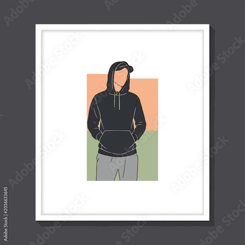 Young man wearing black hoodie standing.