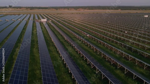Aerial view of solar panels stand in a row in the fields power ecology innovation nature environment green energy landscape electrical power ecology innovation nature environment