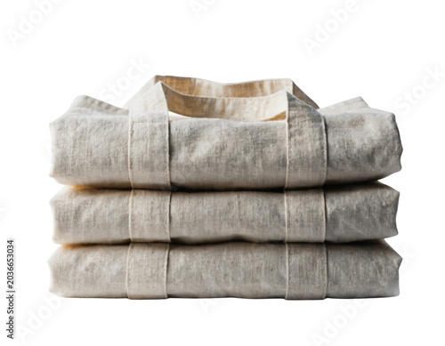 Stack of folded neutral tone linen towels on white background minimalist lifestyle texture