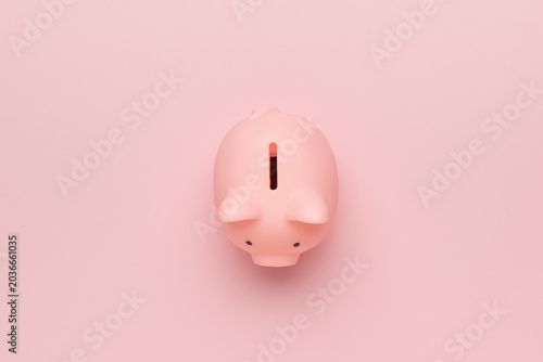 Fotografie Minimalist Pink Piggy Bank on Pastel Background: Symbol of Savings and Financial