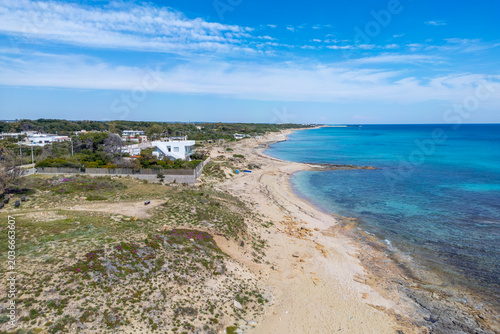 Foto The Spiaggia della Madonnina Beach drone view in Maruggio Town (near Taranto, Pu