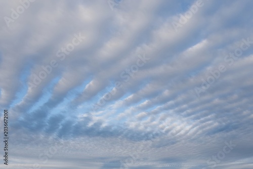 Tableau sur toile Blue sky full of Altocumulus clouds.