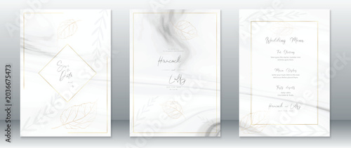 Elegant wedding invitation suite with gold foil accents and white marble texture