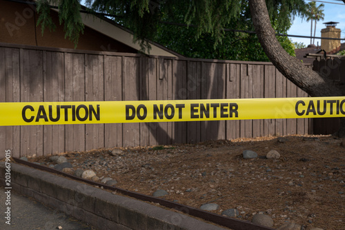 Warning Tape Blocking Access To Restricted Outdoor Area is used to designate a restricted zone and prevent unauthorized entry into a controlled location